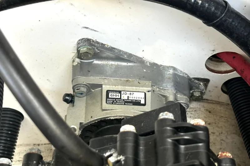 Slide: The Image of Close-up of Yamaha SX210 2020 engine component with label and wiring. - 49