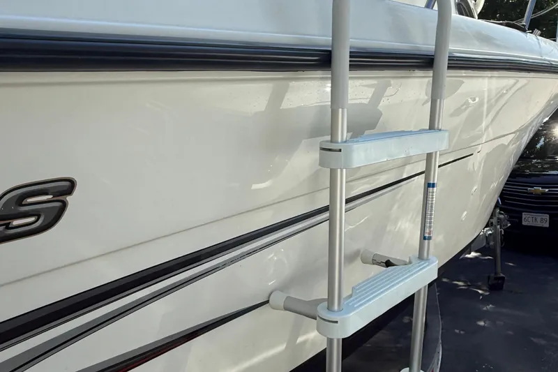 Slide: The Image of 2004 Hydra-Sports Lightning 230 WA boat with ladder, side view. - 10