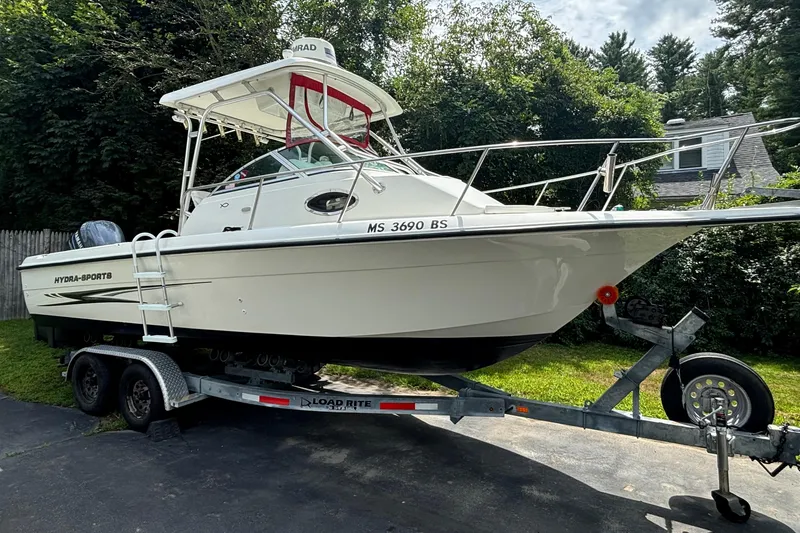 Slide: The Image of 2004 Hydra-Sports Lightning 230 WA boat on trailer, parked outdoors. - 2