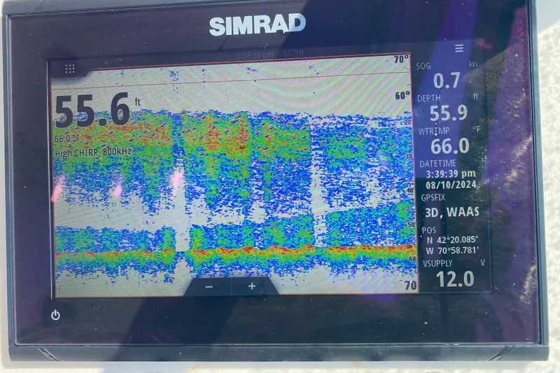 Slide: The Image of Simrad fishfinder display on 2004 Hydra-Sports Lightning 230 WA, showing depth and water temperature. - 9