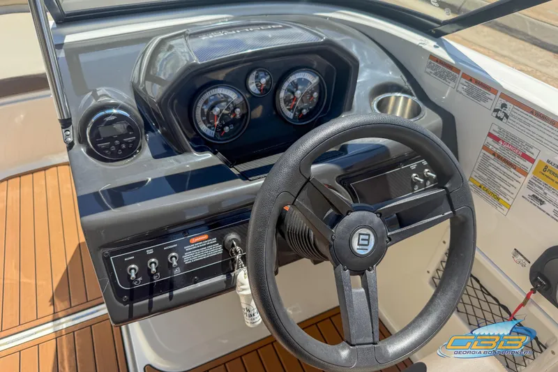 Slide: The Image of 2018 Bayliner VR5 Bowrider I/O dashboard with steering wheel and instrument panel. - 10
