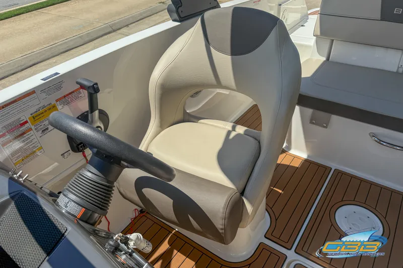 Slide: The Image of 2018 Bayliner VR5 Bowrider I/O cockpit with steering wheel and comfortable seating. - 12