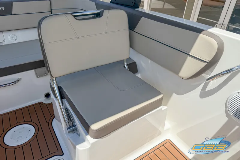 Slide: The Image of 2018 Bayliner VR5 Bowrider I/O interior with beige seating and teak-style flooring. - 13