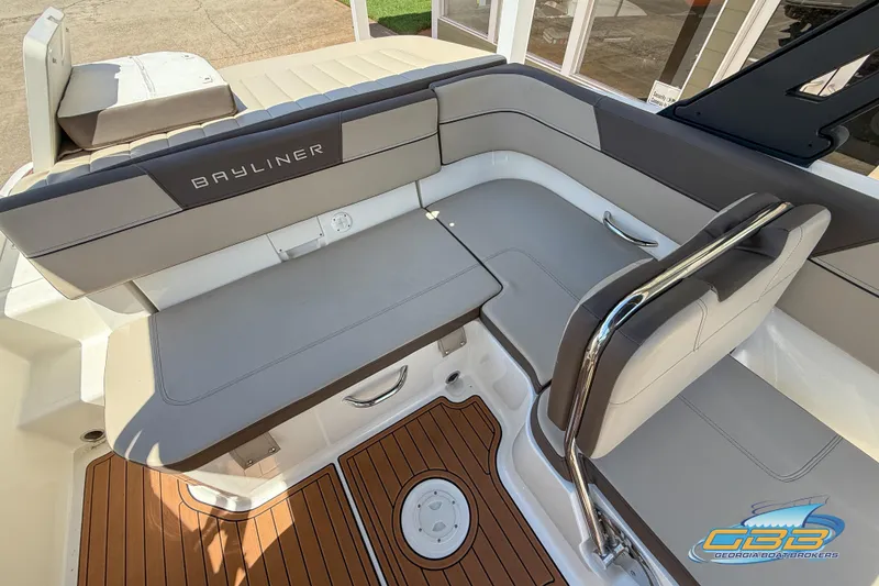 Slide: The Image of 2018 Bayliner VR5 Bowrider I/O interior with gray seating and teak-style flooring. - 14