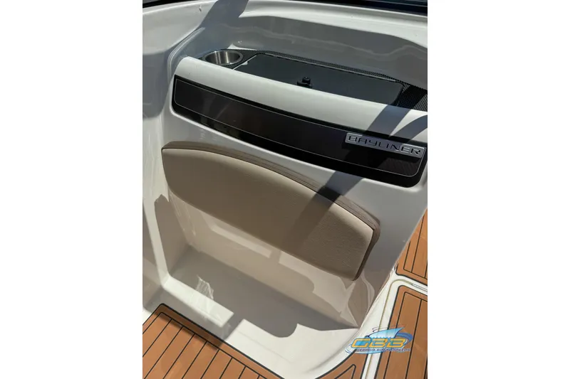 Slide: The Image of 2018 Bayliner VR5 Bowrider I/O interior detail with cup holder and logo. - 16