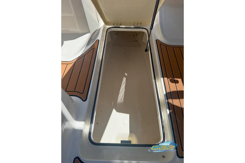 Slide: The Image of 2018 Bayliner VR5 Bowrider I/O storage compartment with teak-style flooring. - 17