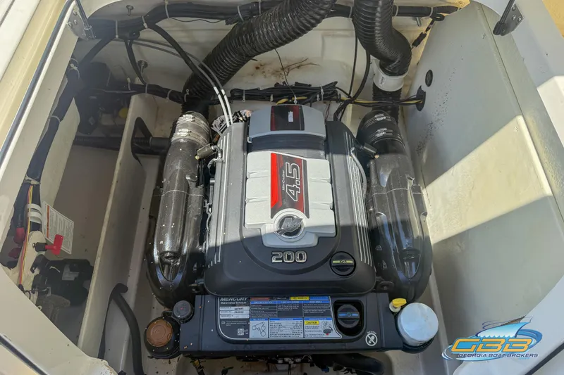 Slide: The Image of 2018 Bayliner VR5 Bowrider I/O engine compartment with Mercury 4.5L 200 HP engine. - 19