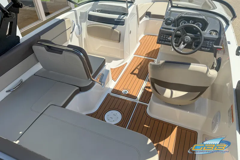 Slide: The Image of 2018 Bayliner VR5 Bowrider I/O interior with seating and steering console. - 5