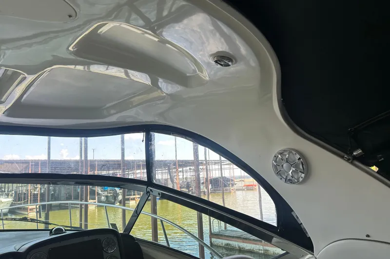 Slide: The Image of Interior view of 2006 Sea Ray 380 Sundancer boat with marina background. - 17