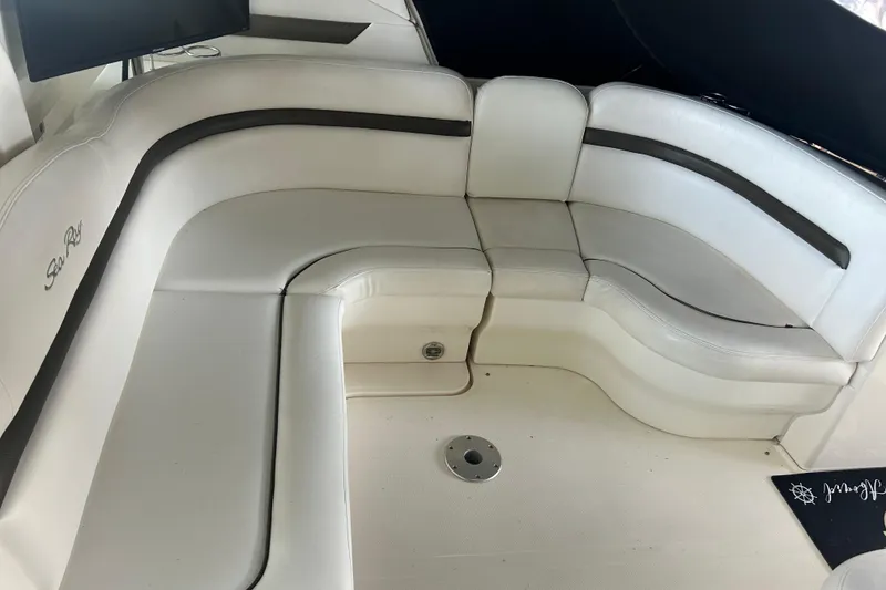 Slide: The Image of 2006 Sea Ray 380 Sundancer interior with white leather seating and sleek design. - 21