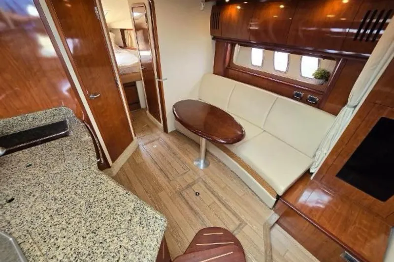 Slide: The Image of Luxurious interior of 2006 Sea Ray 380 Sundancer yacht with elegant wood finishes. - 4