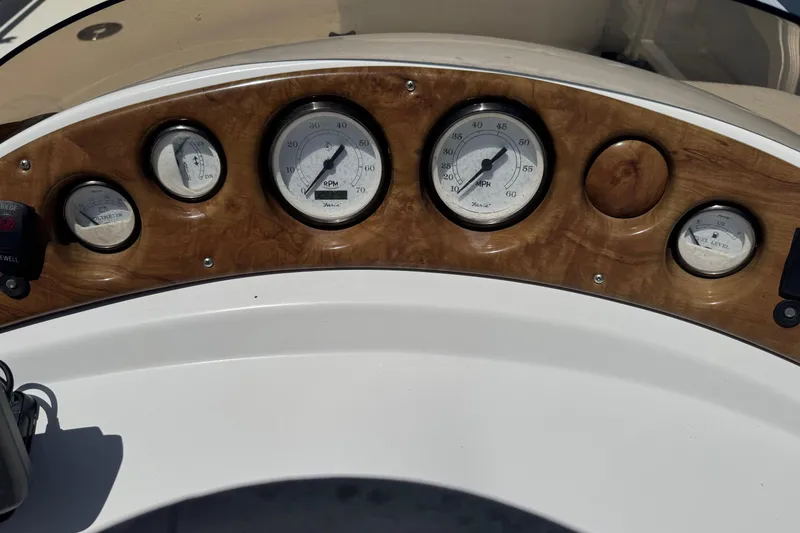 Slide: The Image of Dashboard of 2013 SouthWind 229 L boat with gauges and wood finish. - 10