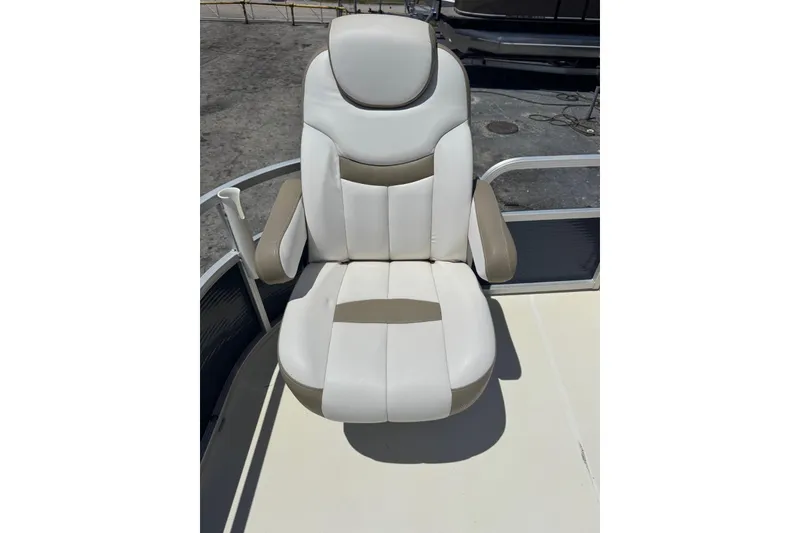 Slide: The Image of Captain's chair on 2013 SouthWind 229 L boat, featuring white and beige upholstery. - 17