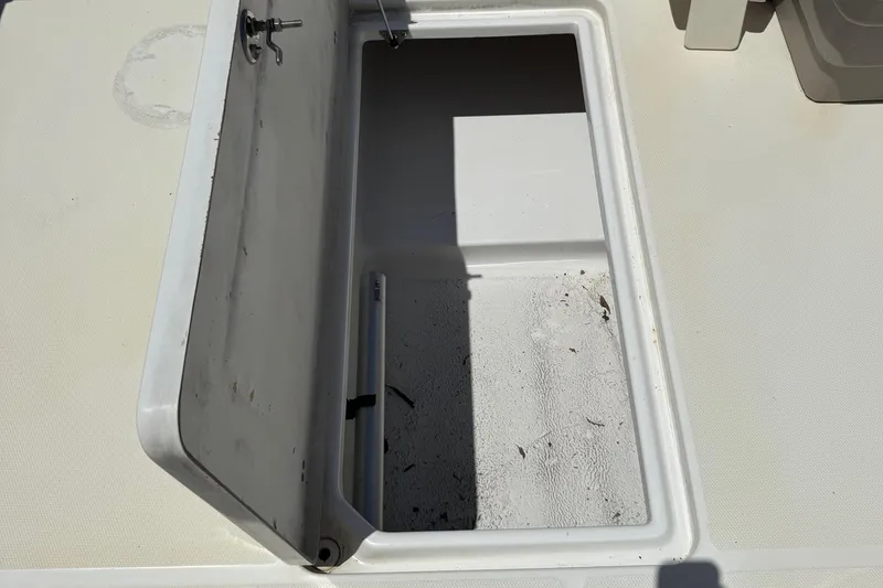Slide: The Image of Open storage compartment on 2013 SouthWind 229 L boat deck. - 20