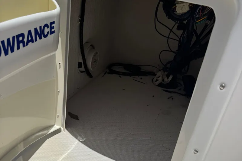 Slide: The Image of Interior view of a 2013 SouthWind 229 L boat compartment with wiring and equipment. - 21