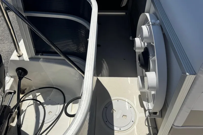 Slide: The Image of Interior view of a 2013 SouthWind 229 L boat, showcasing seating and equipment. - 22