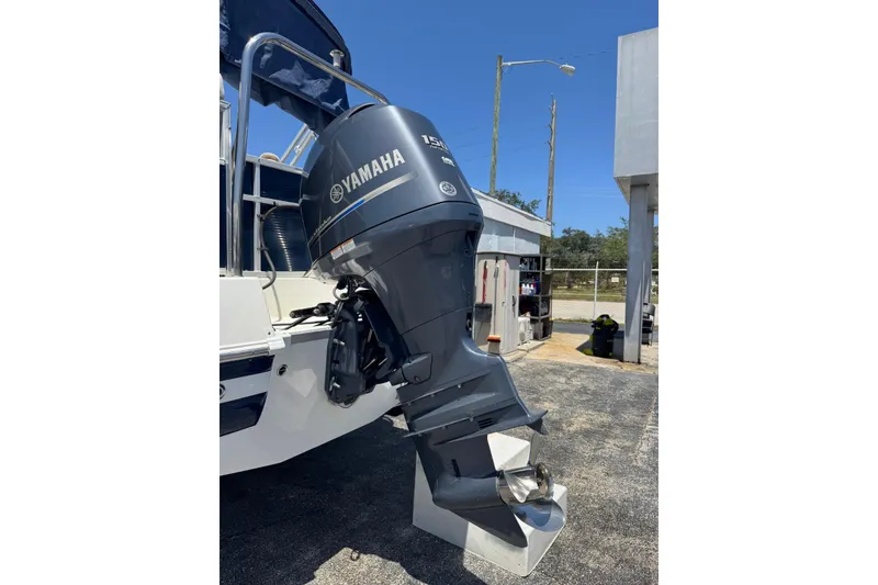 Slide: The Image of 2013 SouthWind 229 L boat with Yamaha outboard motor in a marina setting. - 23