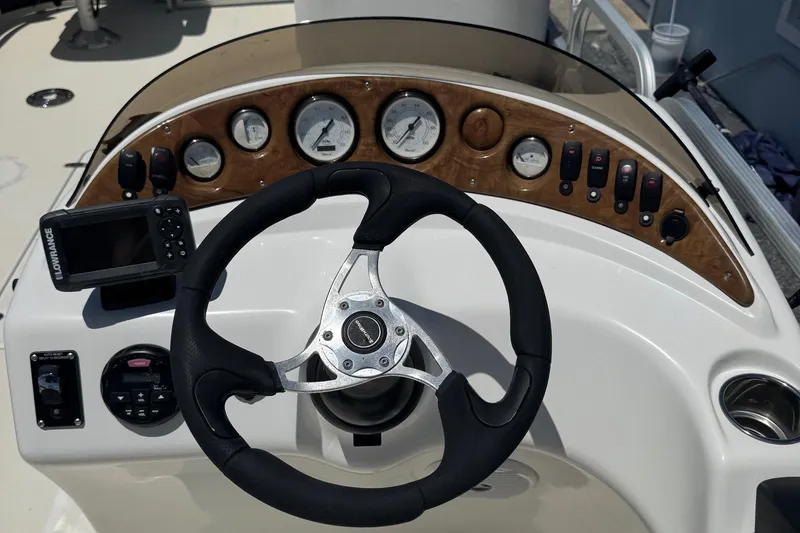Slide: The Image of Steering console of 2013 SouthWind 229 L boat with gauges and navigation equipment. - 5