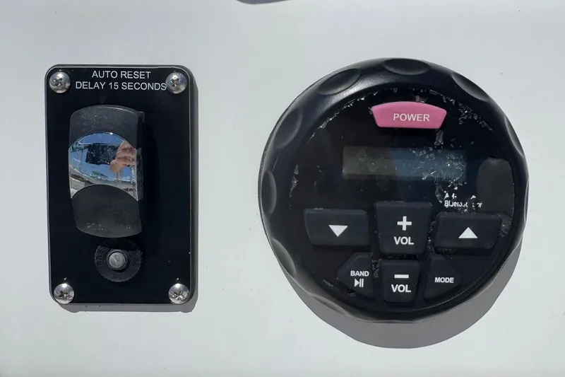 Slide: The Image of Control panel of a 2013 SouthWind 229 L boat with power and volume buttons. - 6