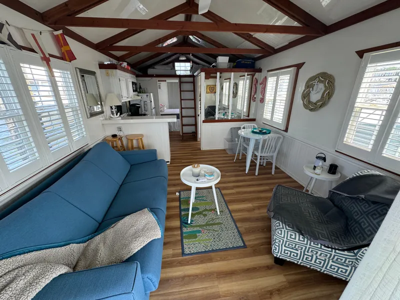 Slide: The Image of Interior of 2009 Catamaran Cruisers Aqua Lodge with cozy seating and modern kitchen. - 5