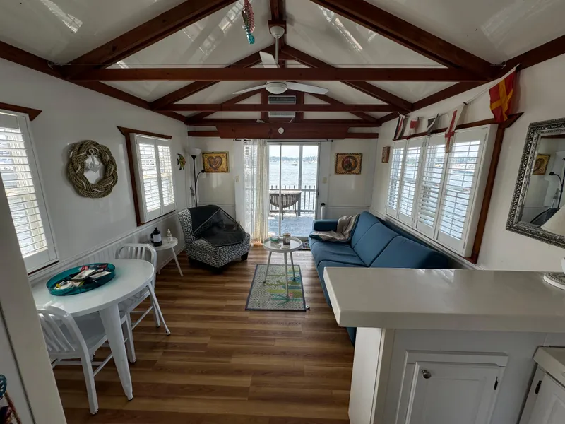 Slide: The Image of Interior of 2009 Catamaran Cruisers Aqua Lodge with cozy seating and nautical decor. - 8