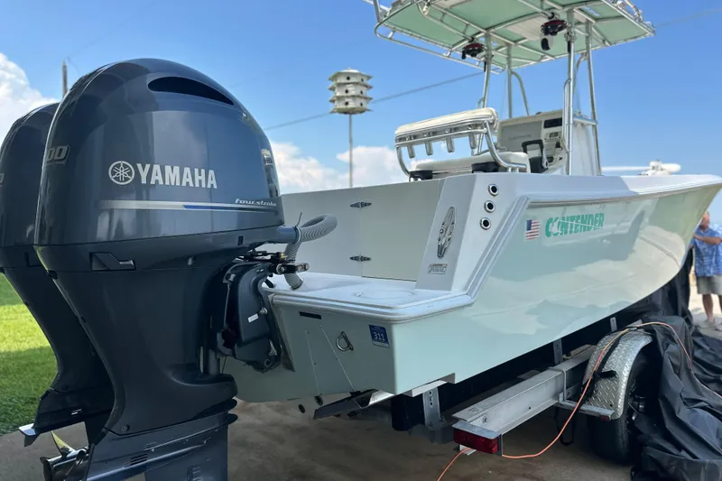 Slide: The Image of 2013 Contender 25 Tournament boat with Yamaha outboard engines on a trailer. - 15