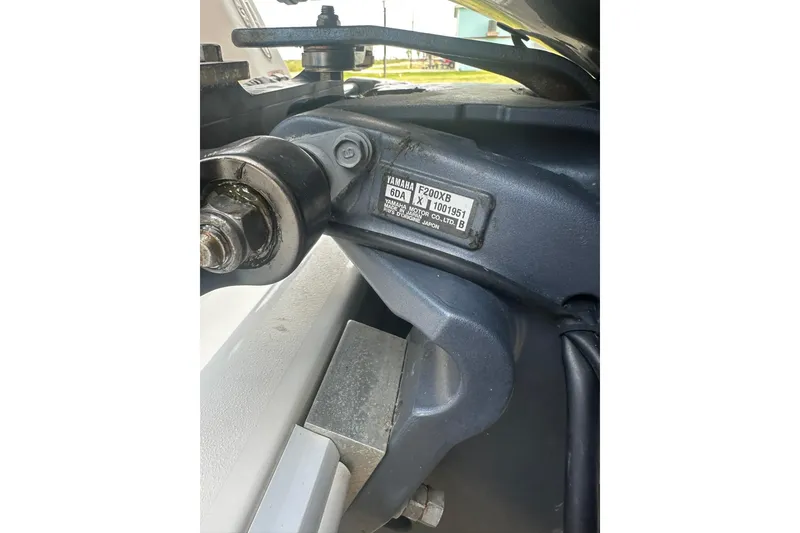 Slide: The Image of Close-up of Yamaha F200XB engine part on 2013 Contender 25 Tournament boat. - 23