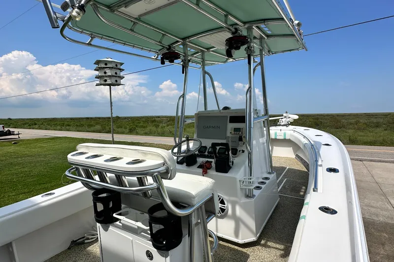 Slide: The Image of 2013 Contender 25 Tournament boat with Garmin electronics, parked on a sunny day. - 27