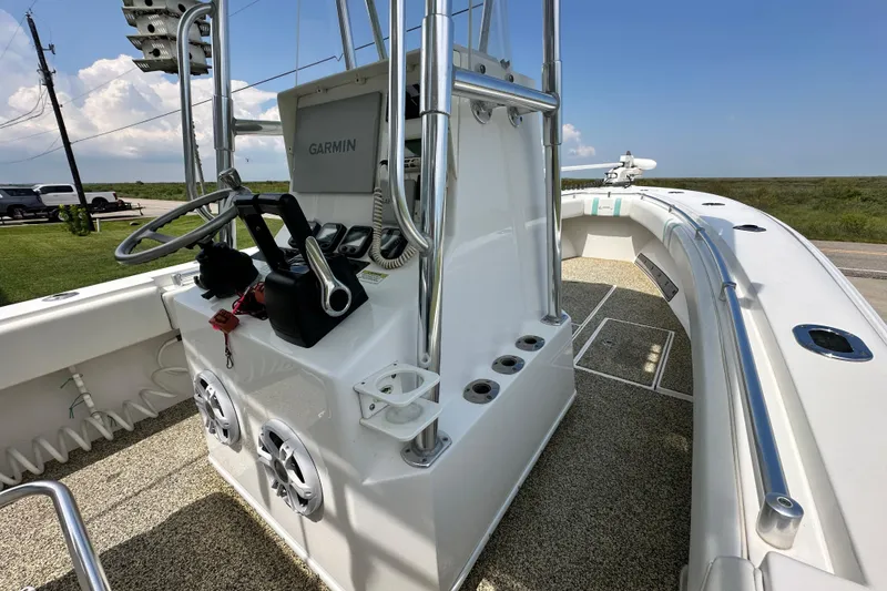 Slide: The Image of 2013 Contender 25 Tournament boat interior with Garmin navigation system and steering wheel. - 34