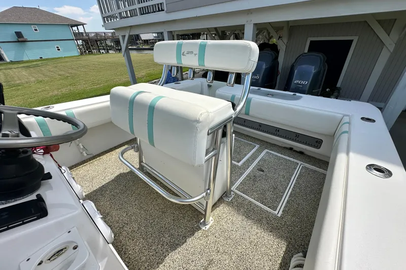 Slide: The Image of 2013 Contender 25 Tournament boat interior with seating and steering wheel. - 37