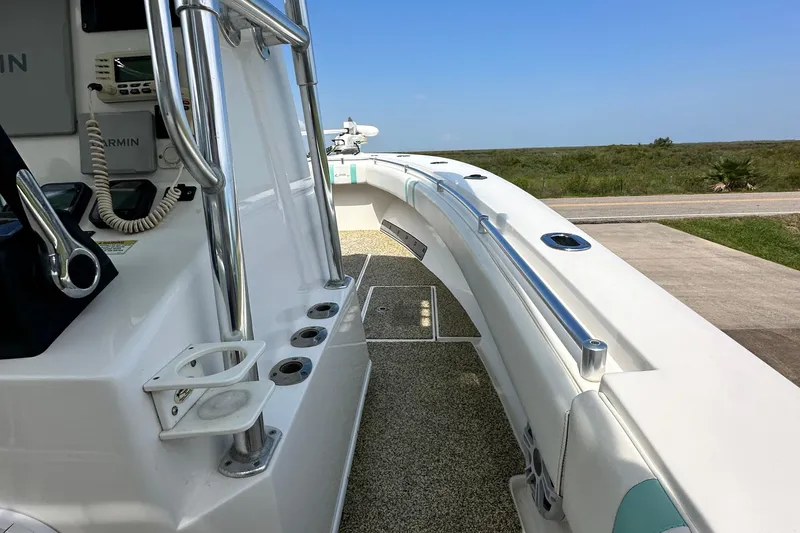 Slide: The Image of 2013 Contender 25 Tournament boat deck with rod holders and Garmin equipment. - 38