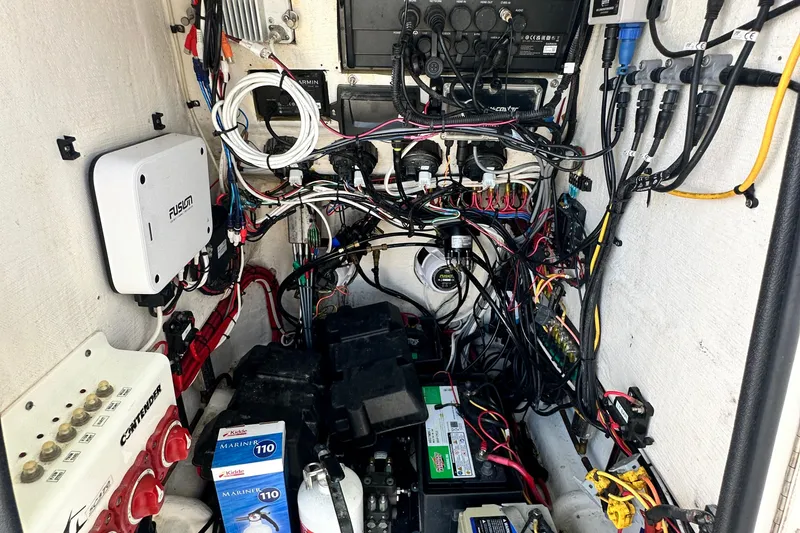 Slide: The Image of Electrical wiring and components inside a 2013 Contender 25 Tournament boat. - 50