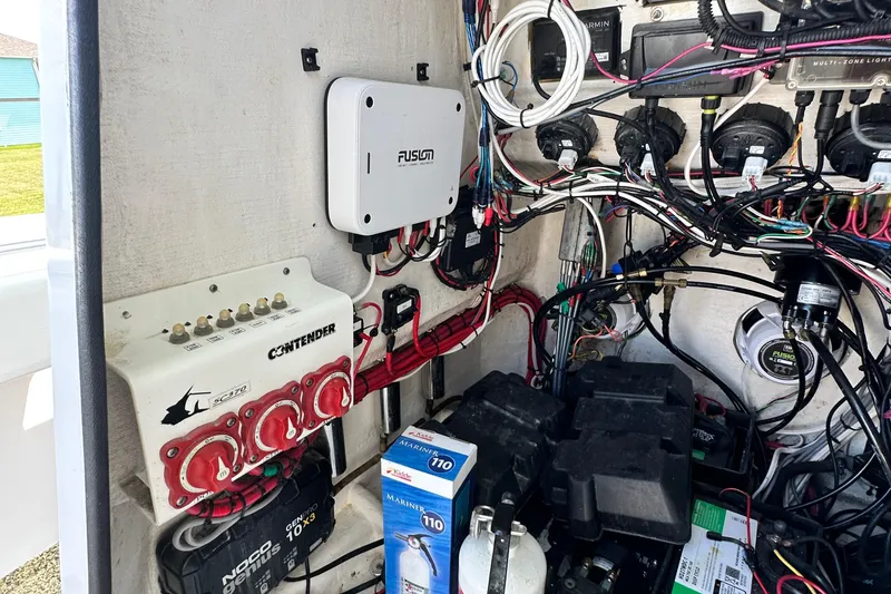 Slide: The Image of Electrical system of a 2013 Contender 25 Tournament boat, featuring wiring and components. - 51