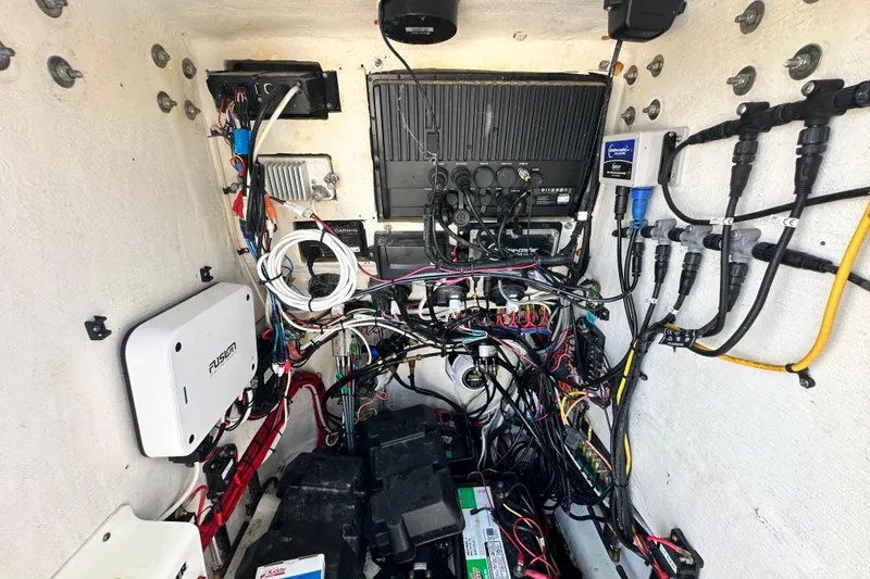Slide: The Image of Electrical wiring and components inside a 2013 Contender 25 Tournament boat. - 52