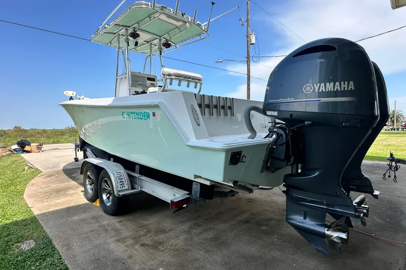 Slide: The Image of 2013 Contender 25 Tournament boat with Yamaha outboard motor on trailer. - 6