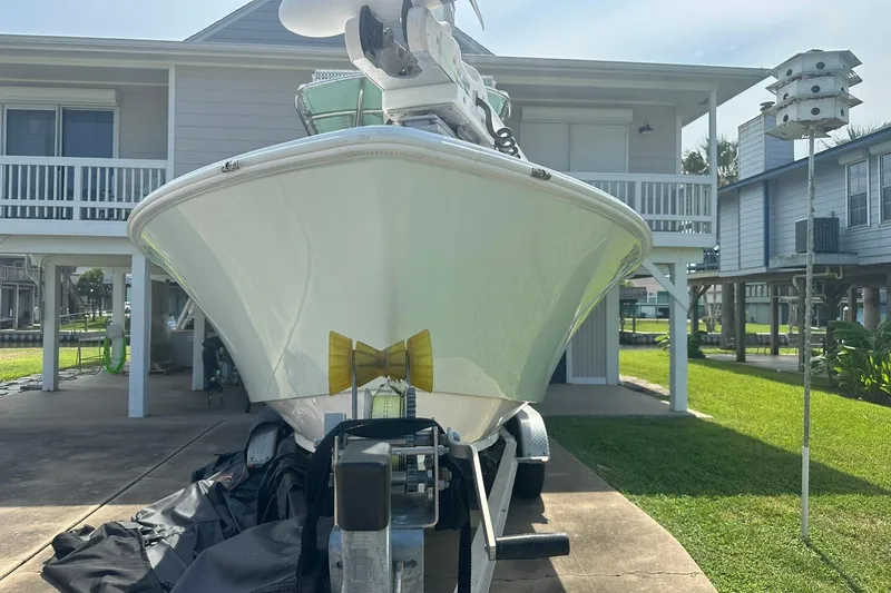 Slide: The Image of 2013 Contender 25 Tournament boat on trailer in residential driveway. - 8