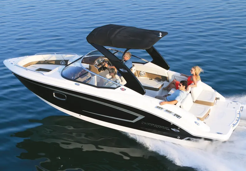 Slide: The Image of 2013 Chaparral 257 SSX boat cruising on water with passengers. - 20