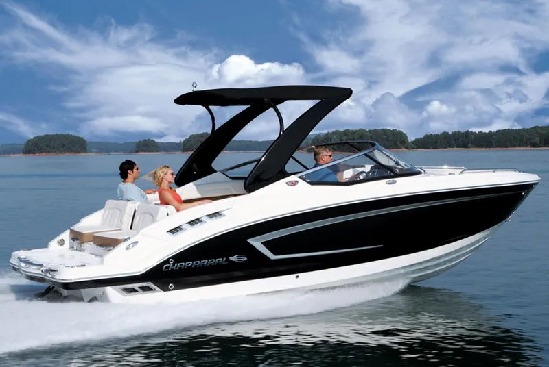 Slide: The Image of 2013 Chaparral 257 SSX speedboat cruising on a lake with passengers. - 21