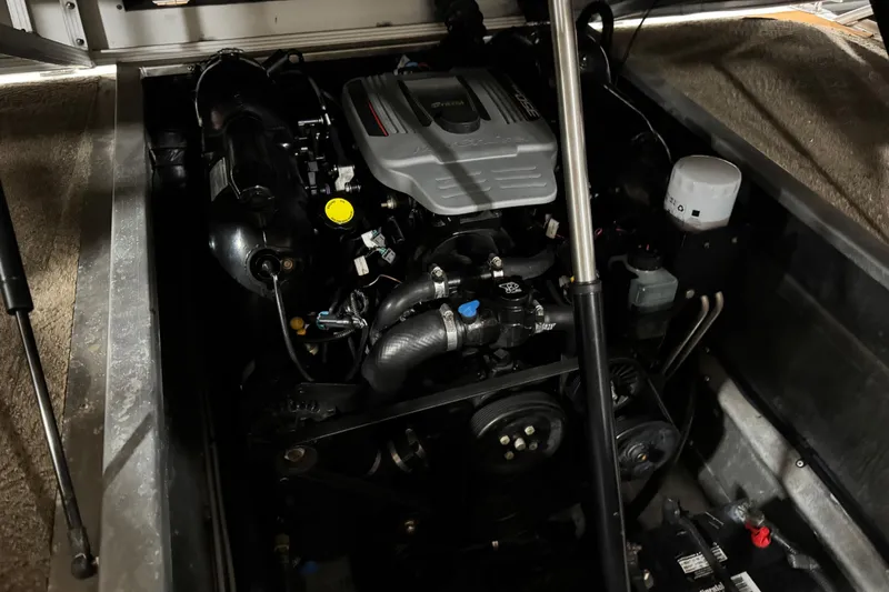 Slide: The Image of Engine compartment of a 2011 Bennington 2575 RCW I/O boat, showcasing mechanical components. - 16