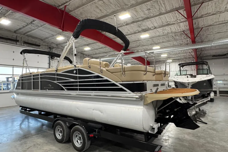 Slide: The Image of 2011 Bennington 2575 RCW I/O pontoon boat in indoor storage on trailer. - 3