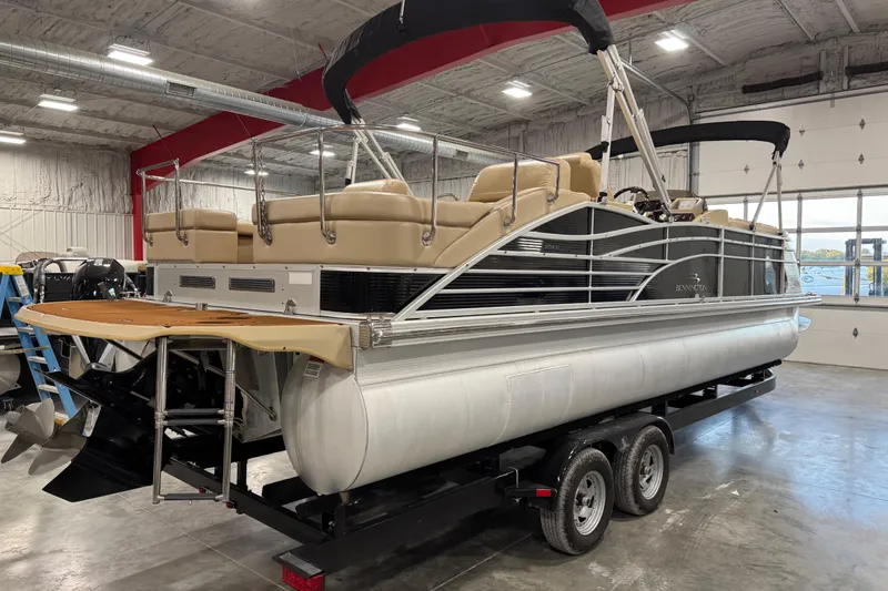 Slide: The Image of 2011 Bennington 2575 RCW I/O pontoon boat on trailer in indoor storage. - 4