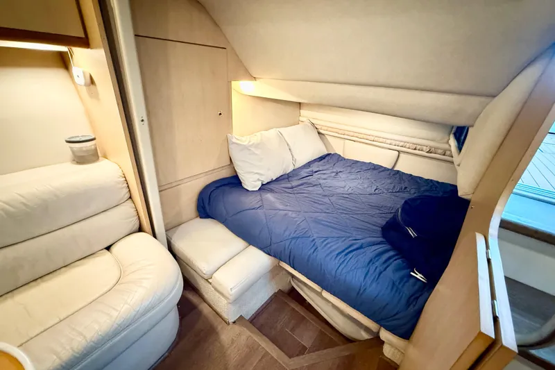 Slide: The Image of Cozy cabin interior of 1998 Regal Commodore 402 yacht with bed and seating. - 14
