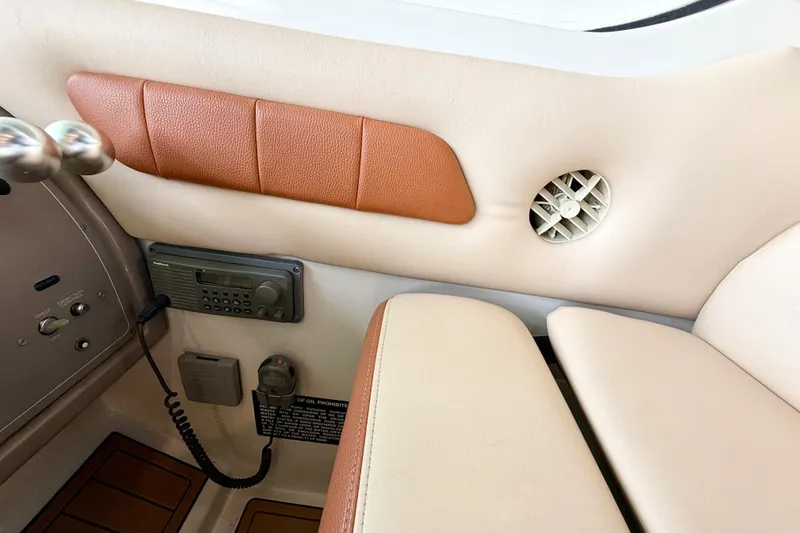 Slide: The Image of 1998 Regal Commodore 402 interior with radio, beige and brown upholstery, and air vent. - 31
