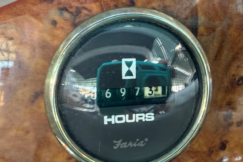 Slide: The Image of Hour meter on 1998 Regal Commodore 402 boat dashboard, showing 697.31 hours. - 39