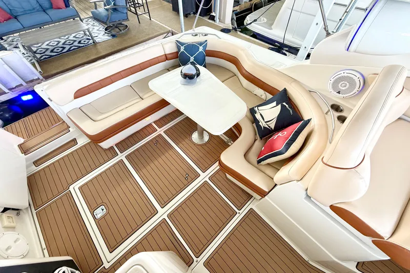 Slide: The Image of Luxurious seating area on a 1998 Regal Commodore 402 yacht with stylish cushions and table. - 4