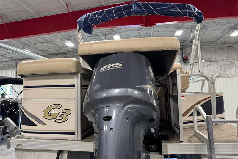 Slide: The Image of 2010 G3 LX3 25 Cruise pontoon boat with 225 horsepower engine in indoor storage. - 6