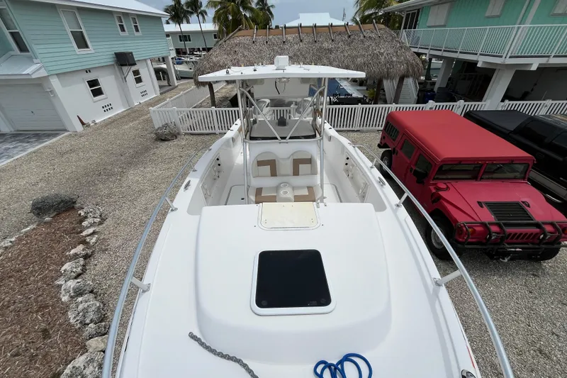Slide: The Image of 2007 ProKat 2860 Center Console boat parked in a residential driveway. - 11