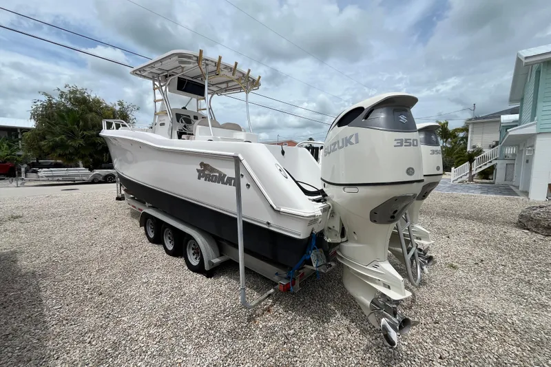 Slide: The Image of 2007 ProKat 2860 Center Console boat with dual Suzuki 350 engines on a trailer. - 5
