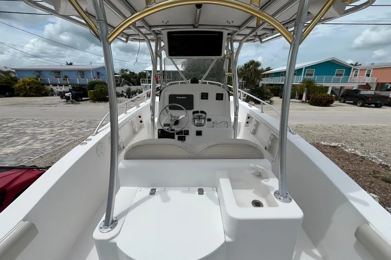 Slide: The Image of 2007 ProKat 2860 Center Console boat interior with steering wheel and controls. - 7