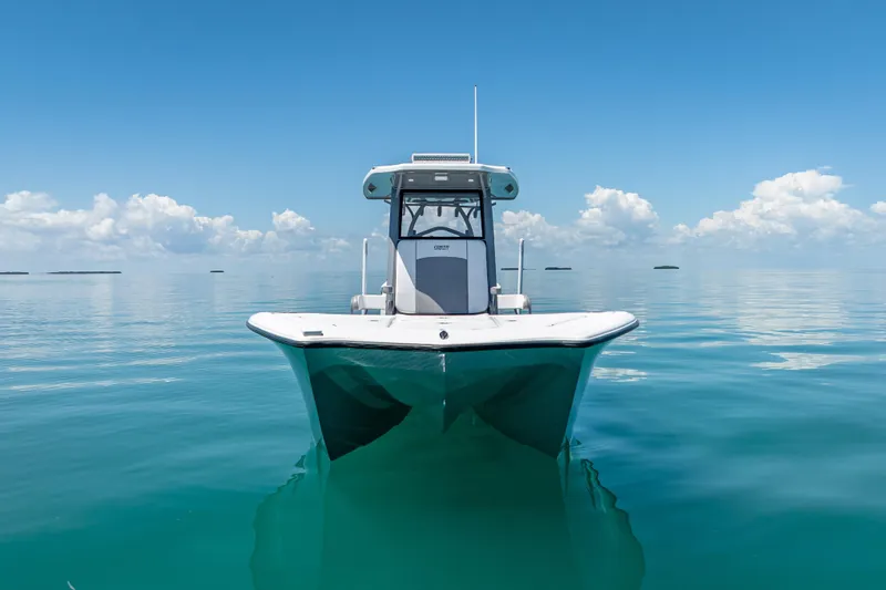 Slide: The Image of 2022 Costa Custom Boats 264 on calm ocean with clear blue sky. - 16